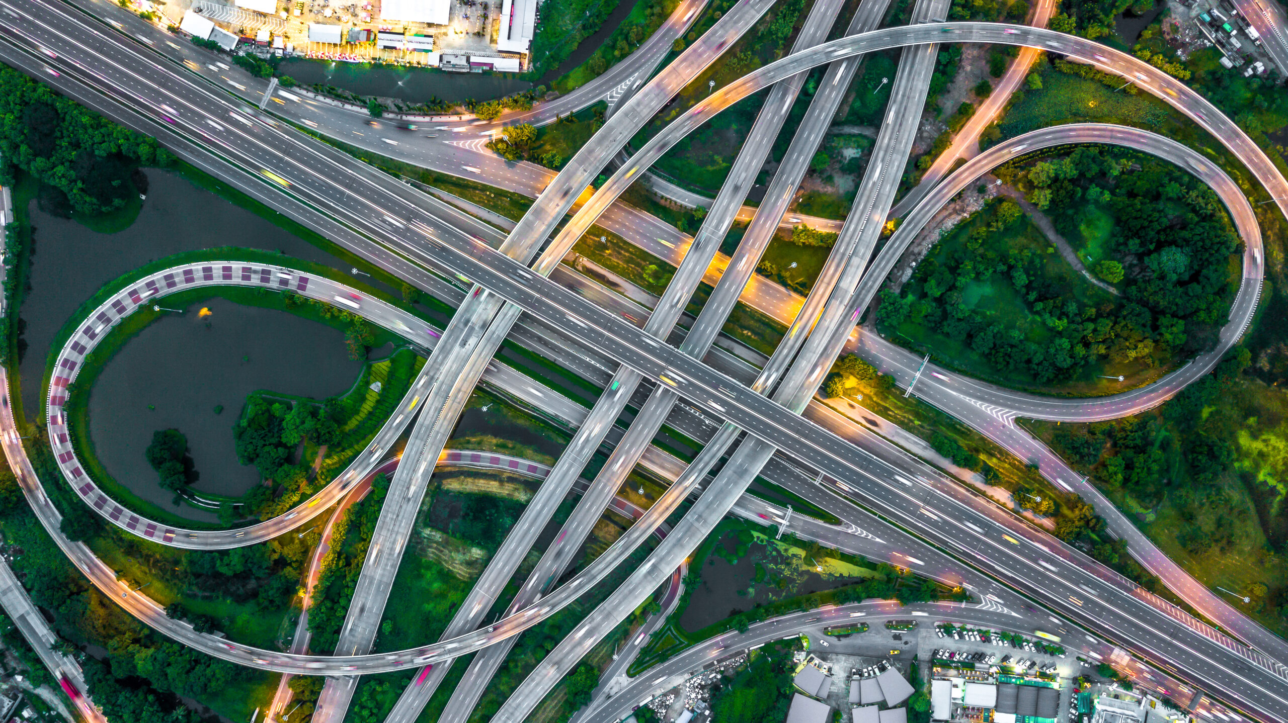 Aerial view elevated road and traffic junctions, Modern construction design traffic ways traffic jams, Road interchange or highway intersection with busy urban traffic Junction network of transportation.
